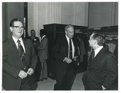 ["Black and white photograph print of Carl Albert speaking with an unidentified man at the reception for freshman members of the 94th Congress. December 1, 1975"]