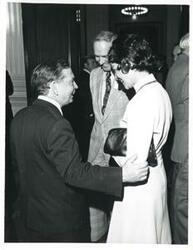 ["Black and white photograph print of Carl Albert speaking with an unidentified woman at a reception for freshman members of the 94th Congress. December 1, 1975"]