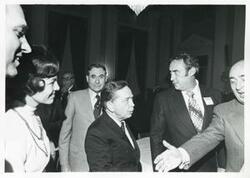 ["Black and white photograph print of John McFall, Carl Albert and others at a reception for freshman members of the 94th Congress. December 1, 1975"]