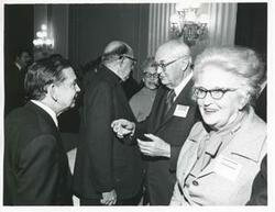 ["Black and white photograph print of Carl Albert with unidentified people at a reception for freshman members of the 94th Congress. December 1, 1975"]
