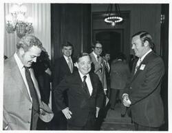 ["Black and white photograph print of Carl Albert with several others at a reception of freshman members of the 94th Congress. December 1, 1975"]