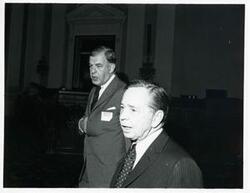 ["Black and white photograph print of Carl Albert with Thomas S. Foley at a reception for freshman members of the 94th Congress. December 1, 1975"]