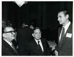["Black and white photograph print of Carl Albert with unidentified people at the reception for freshman members of the 94th Congress. December 1, 1975"]