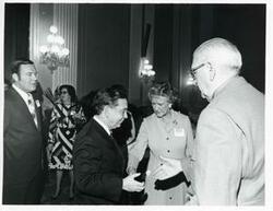 ["Black and white photograph print of Carl Albert with unidentified people at the reception for freshman members of the 94th Congress. December 1, 1975"]