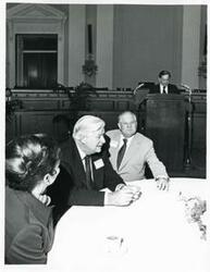 ["Black and white photograph print of Carl Albert, Thomas P. O'Neill, and Olin Teague at a reception for freshman members of the 94th Congress. December 1, 1975"]