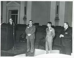 ["Black and white photograph print of Carl Albert and others at a reception for freshman members of the 94th Congress. December 1, 1975"]