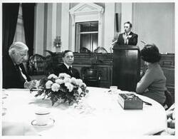 ["Black and white photograph print of Carl Albert and others at a reception honoring freshman members of the 94th Congress. December 1, 1975 Thomas P. O'Neill is also present in 3107"]