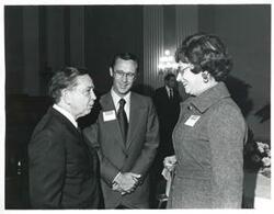 ["Black and white photograph print of Carl Albert speaking with two unidentified people at a reception honoring freshman members of the 94th Congress. December 1, 1975"]
