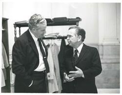 ["Black and white photograph print of Carl Albert speaking with unidentified people at a reception honoring freshman members of the 94th Congress. December 1, 1975"]