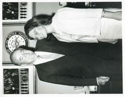["Black and white photograph print of Hubert H. Humphrey posing with an unidentified woman."]