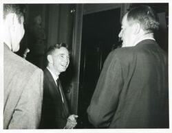 ["Black and white photograph print of Carl Albert speaking with Hubert H. Humphrey."]