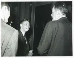 ["Black and white photograph print of Carl Albert speaking with Hubert H. Humphrey."]