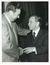 ["Black and white photograph print of Carl Albert with unidentified people."]