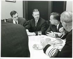 ["Black and white photograph print of George Mahon, Robert S. McNamara, Carl Albert, and others at a luncheon in the Joe Martin Room. March 30 1967"]