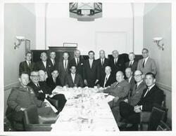 ["Black and white photograph print of Robert L. F. Sikes, Leslie Arends, Carl Albert, and others posing for a picture."]