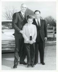 ["Black and white photograph print of Carl Albert posing with Victor Wickersham and an unidentified boy."]