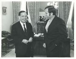 ["Black and white photograph print of Carl Albert with three unidentified people."]