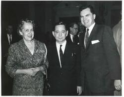["Black and white photograph print of Carl Albert with unidentified people."]