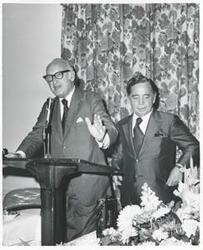 ["Black and white photograph print of Carl Albert standing with an unidentified man."]