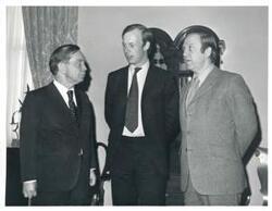 ["Black and white photograph print of Carl Albert with unidentified men."]