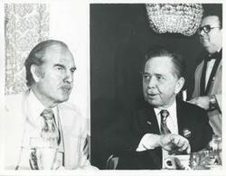 ["Black and white photograph print of George S. McGovern and Carl Albert sitting together at the 1976 Democratic National Convention."]