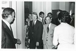 ["Black and white photograph print of Carl Albert, Jimmy Carter, and several others at the 1976 Democratic National Convention."]