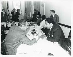 ["Black and white photograph print of Robert Strauss, Carl Albert, Russell B. Long, Thomas P. O'Neill, and others at Democratic leadership conference."]