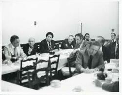 ["Black and white photograph print of several men at the Democratic leadership conference."]