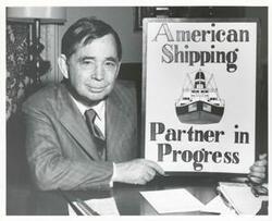 ["Black and white photograph print of Carl Albert with the winning poster of the 1970 National Maritime Poster Contest designed by Eddie Moore from McAlester, Oklahoma. May 1970"]