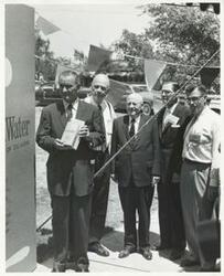 ["Black and white photograph print of Vice-President Lyndon B. Johnson, Robert S. Kerr, Sam Rayburn, Dean A. McGee, and an unidentified man at a party commemorating the publication of Kerr's book, Land, Wood and Water. August 1960"]