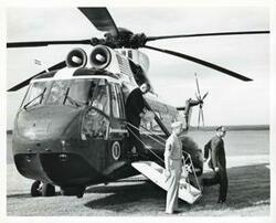 ["Black and white photograph print of Lyndon B. Johnson exiting the helicopter at Eufaula for the dedication of the Eufaula Dam and Reservoir by President Johnson, September 25, 1964"]