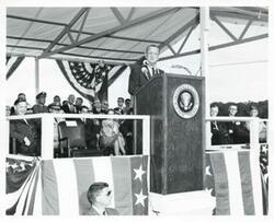 ["Black and white photograph print of Lyndon B. Johnson speaking at the Eufaula Dam and Reservoir dedication. September 25, 1964"]