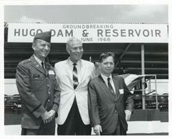 ["Black and white photograph print of Carl Albert, A. S. Mike Monroney, and another man at the Hugo Dam and Reservoir groundbreaking ceremony. June 30, 1968"]