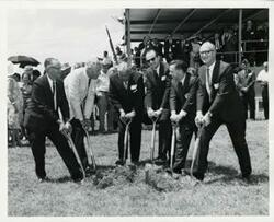 ["Black and white photograph print of Carl Albert, A. S. Mike Monroney, and others at the groundbreaking ceremony of the Hugo Dam and Reservoir. June 30, 1968"]