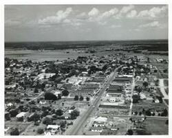 ["Black and white photograph print of aerial view of Wilson, Oklahoma."]