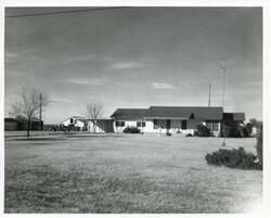 ["Black and white photograph print of ranch home of Mr. and Mrs. Lonnie Rooney, northwest of Wilson, Oklahoma, on Highway 70"]