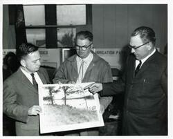 ["Black and white photograph print of Carl Albert with Colonel R. A. Howard, Jr. (U.S. Army Retired), and Bill Montgomery from the Bayou watershed."]