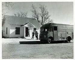 ["Black and white photograph print of view of Wilson, Oklahoma, library."]