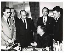 ["Black and white photograph print of Carl Albert with Rex Privett and four other unidentified men"]