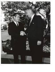 ["Black and White photograph of Senator Fred Harris of Oklahoma and President Lyndon Johnson"]