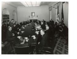 ["Black and White photograph of Lyndon B. Johnson and a National Security Council meeting.  Those present include:  George Aiken, Carl Albert, Averell Harriman, Carl Hayden, Hubert H. Humphrey, and Robert S. McNamara. April 3,1965"]
