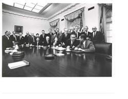 ["Black and White photograph, on stock paper, of Lyndon B. Johnson and Hubert Humphrey with the House and Senate leadership.  Those present include: George Aiken, Carl Albert, Hale Boggs, Everett M. Dirksen, Charles Halleck, Carl Hayden, Hubert H. Humphrey, Mike Mansfield, John. W. McCormack, and Robert S. McNamara."]