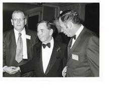 ["Black and White photograph of Carl Albert with Buster Highe and Chris Murphy at a Carl Albert appreciation dinner."]