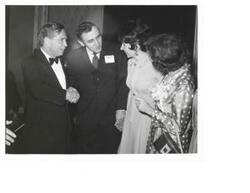 ["Black and White photograph of Carl Albert and his wife with an unidentified couple at the Carl Albert appreciation dinner."]