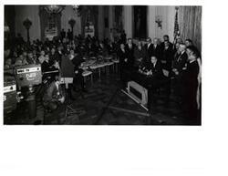["Black and white photograph of Lyndon B. Johnson at a bill-signing ceremony with television cameras.  Others present include: Carl Albert, Hubert H. Humphrey, and John W. McCormack."]