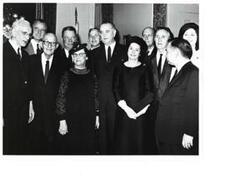 ["Black and white photograph of Lyndon B. and Lady Bird Johnson, John W. McCormack, Mike Mansfield (Montana Senator), Carl Hayden (Arizona Senator), Hale Boggs, and Carl Albert."]