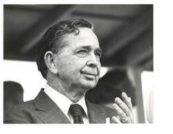["Black and white photograph portrait of Carl Albert from the shoulders up, taken in McAlester, Oklahoma on Armed Services Day 1976"]