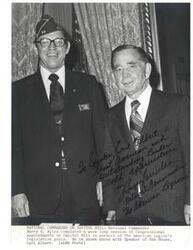 ["Black and white photograph of Carl Albert and Harry Wiles (National Commander of the American Legion), in Speaker's office. November 17, 1975. Handwritten message from Harry Wiles to Carl Albert, with signature,  on photograph."]