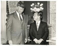 ["Black and white photograph of Carl Albert with American Legion National Commander John Geiger (in office)."]