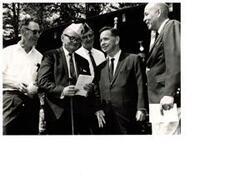 ["Black and white photograph of Carl Albert with a DAV group. Man on Carl's immediate right (left foreground) is D.A.V. Representative  Lambert Barkman."]